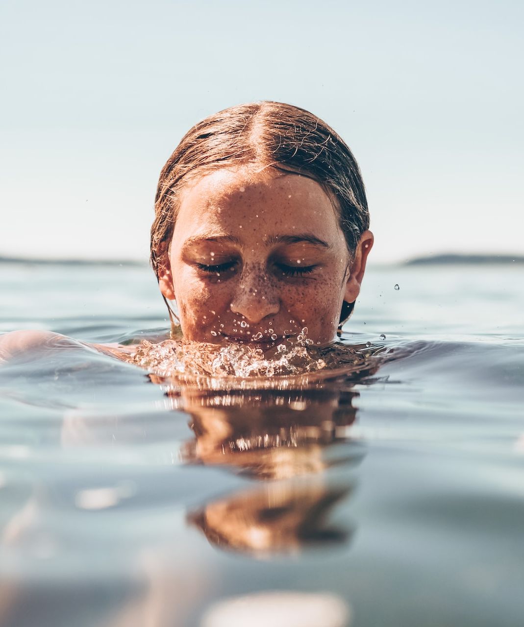 Girl swimming in sea