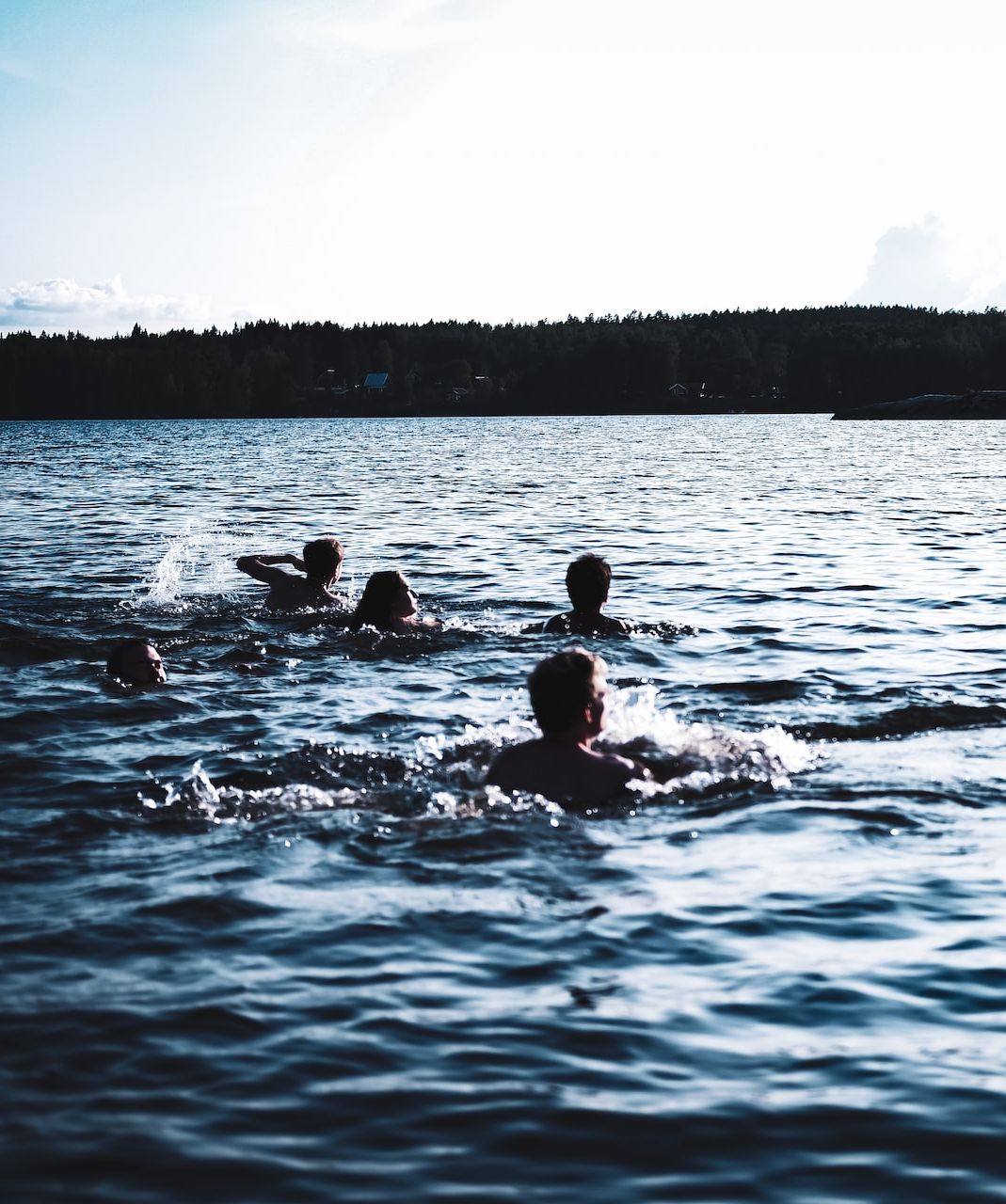 People swimming in sea