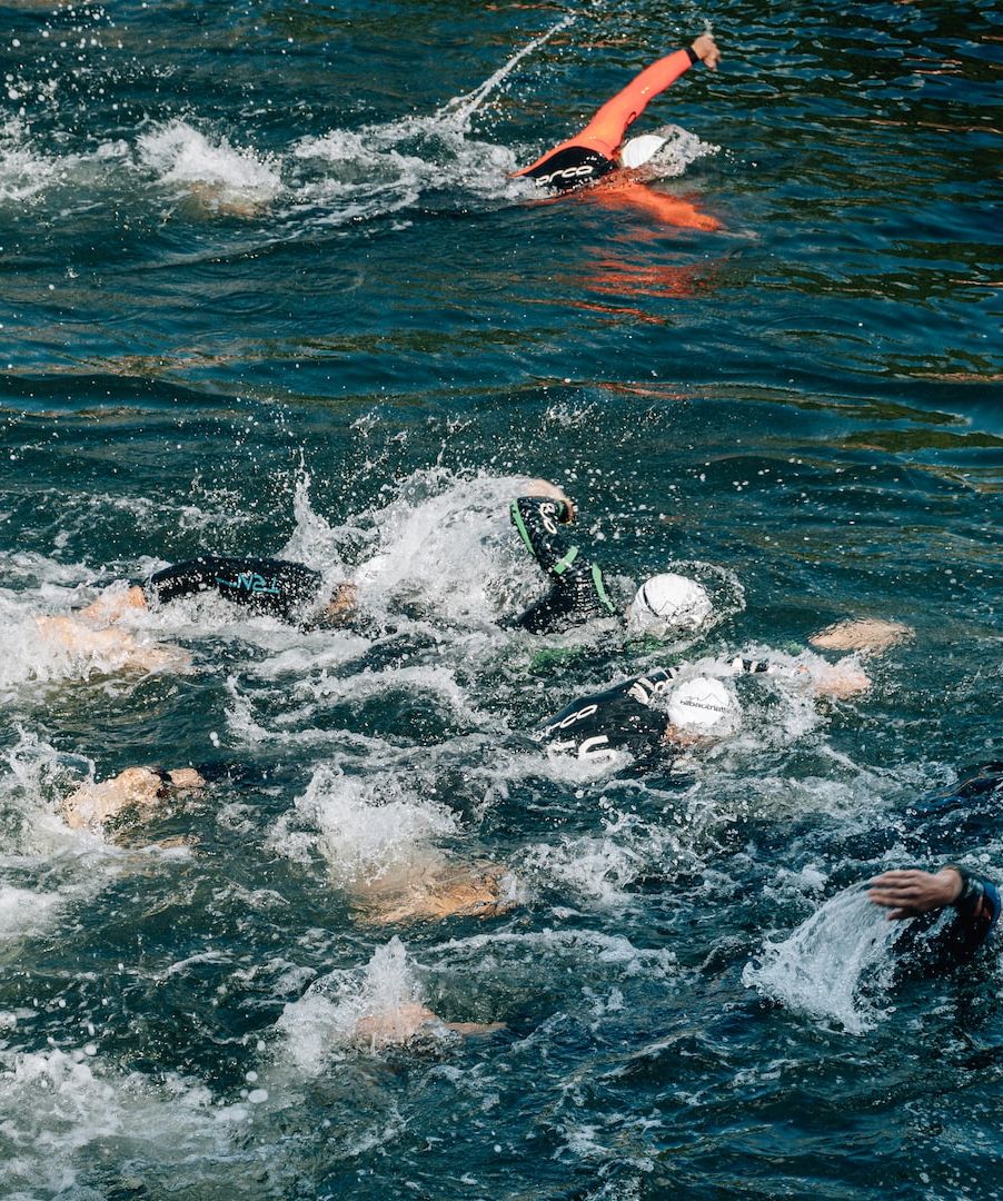 People swimming in sea