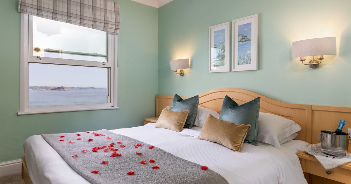 Double bed with rose petals