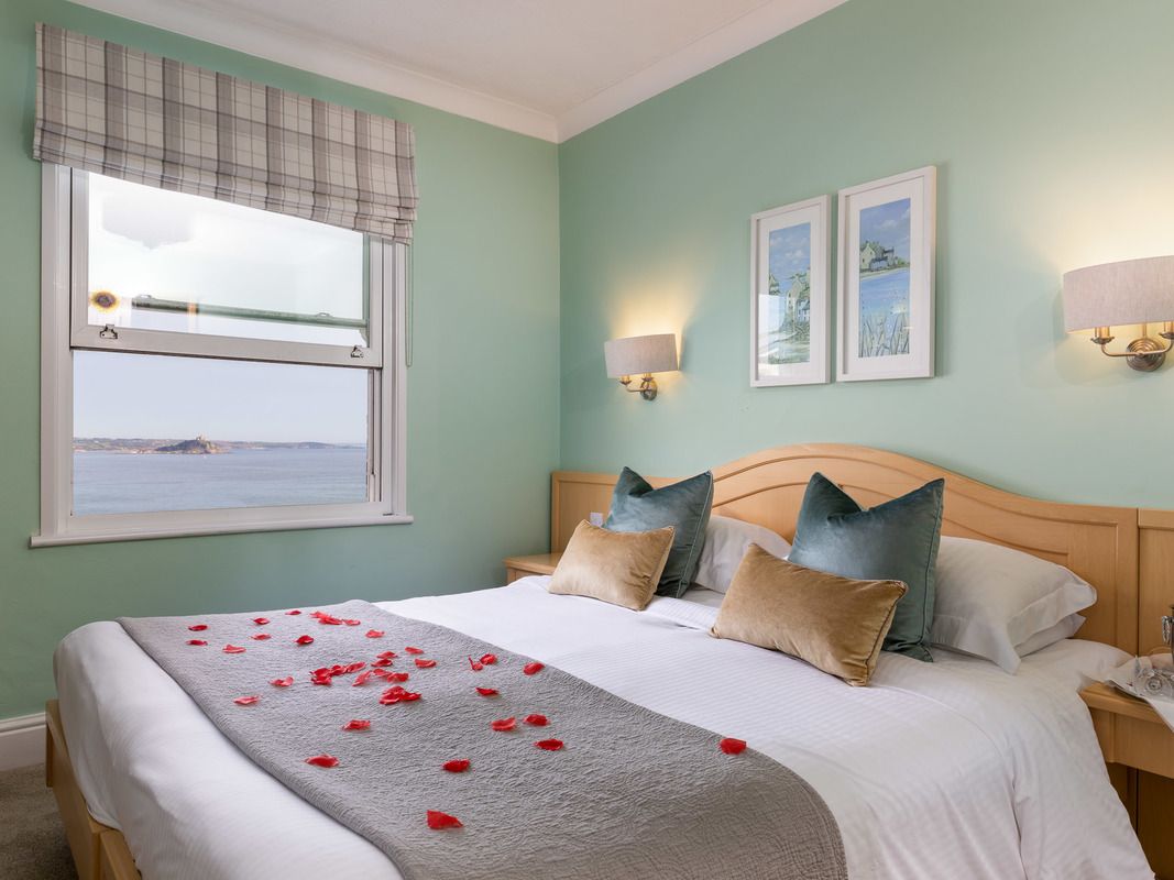 Double bed with rose petals