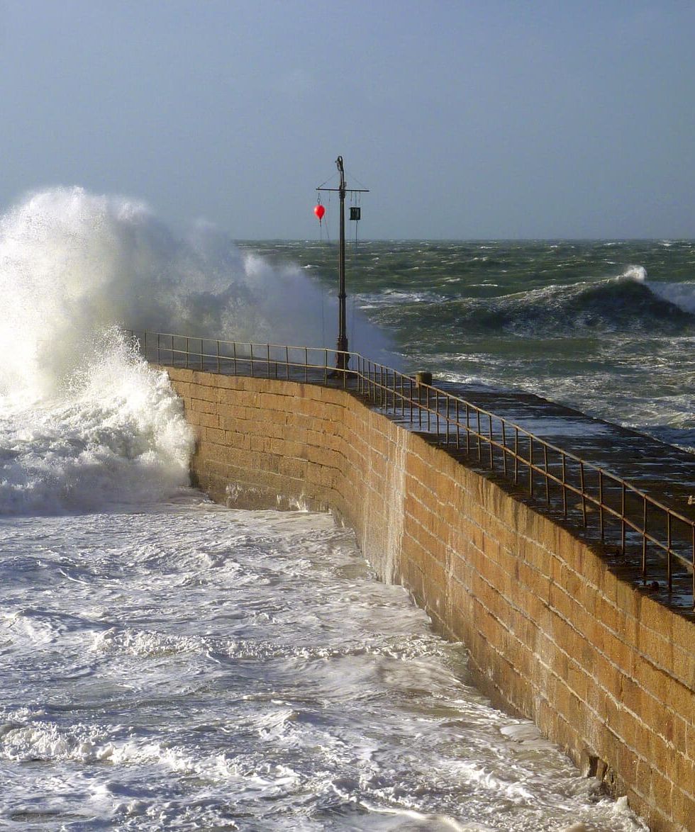 Waves crashing into sea wall
