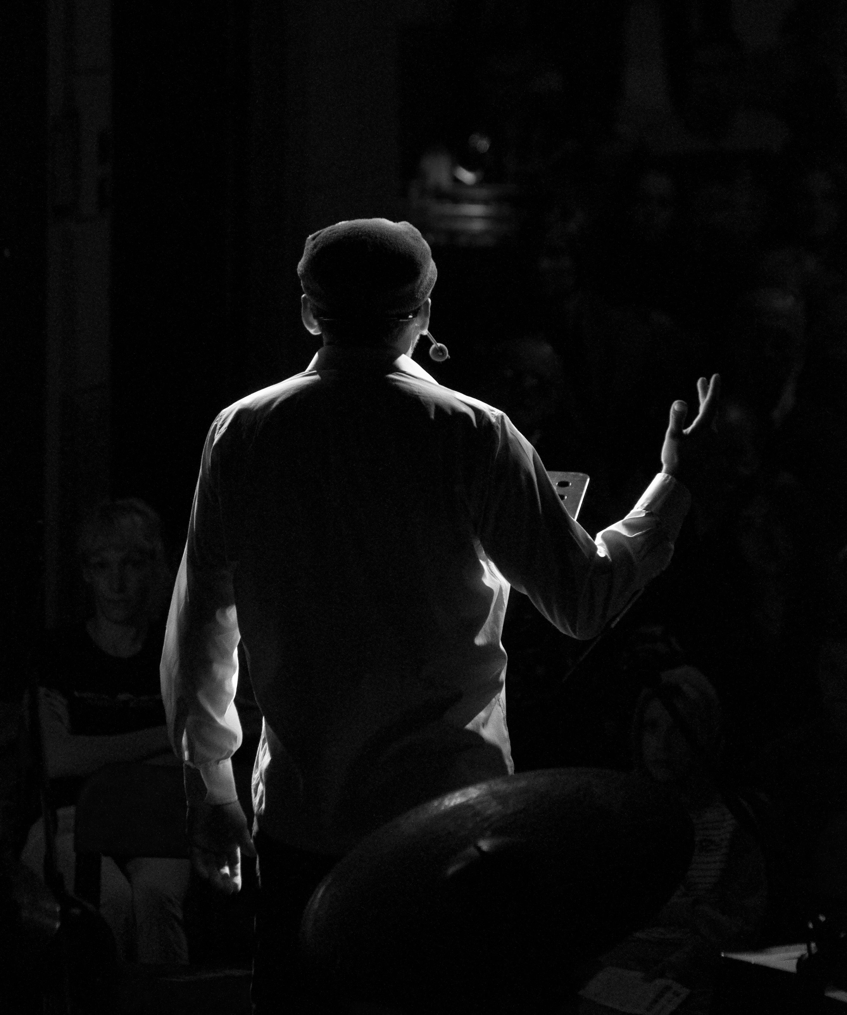 Backlit actor on stage